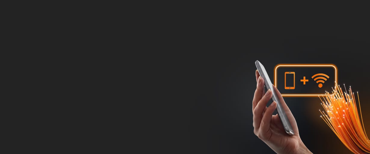 Dłoń trzymająca smartfon, obok ikony telefonu i Wi-Fi połączone plusem